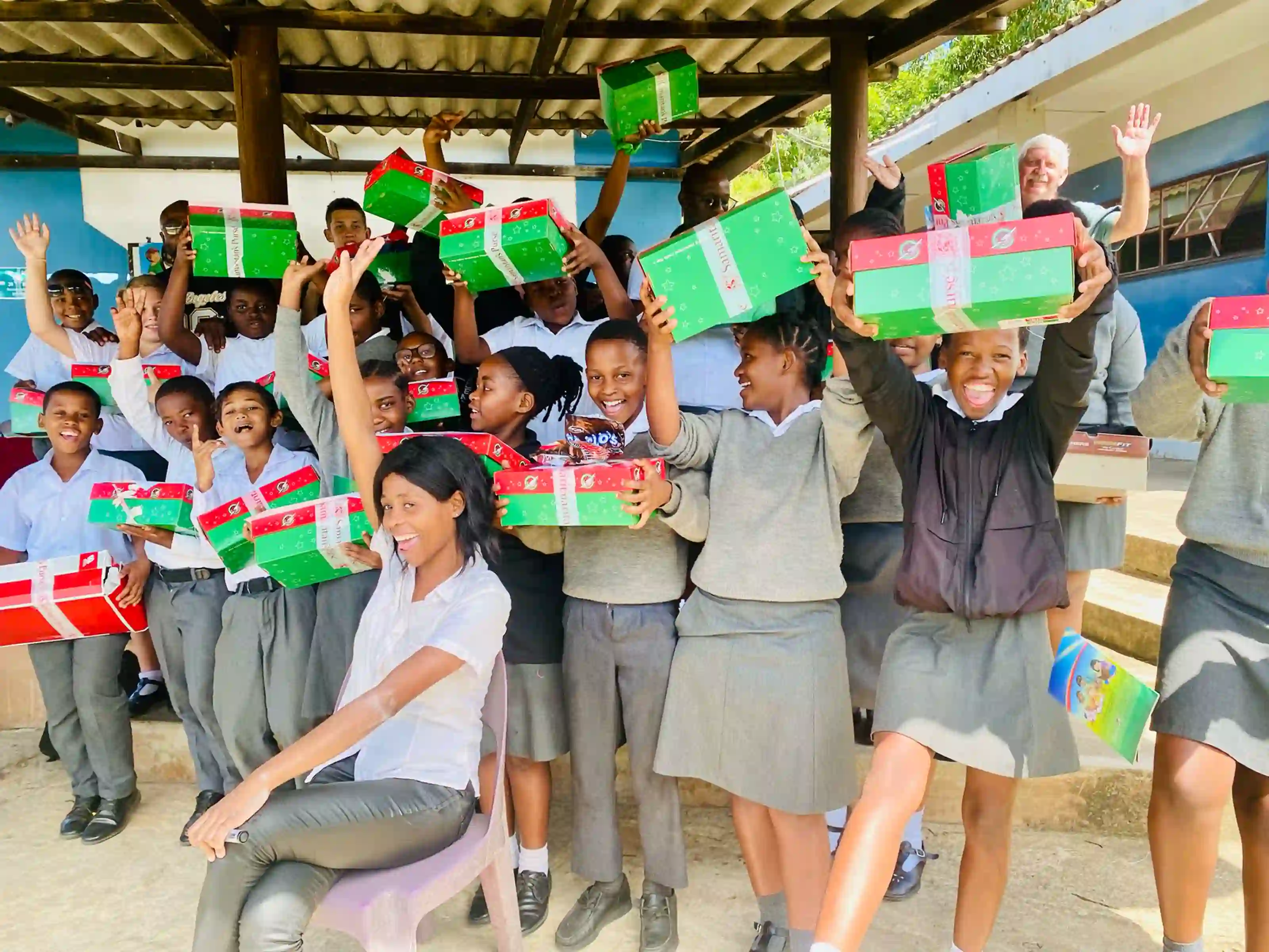 Hibberdene Academy learners celebrating a Christmas shoebox distribution